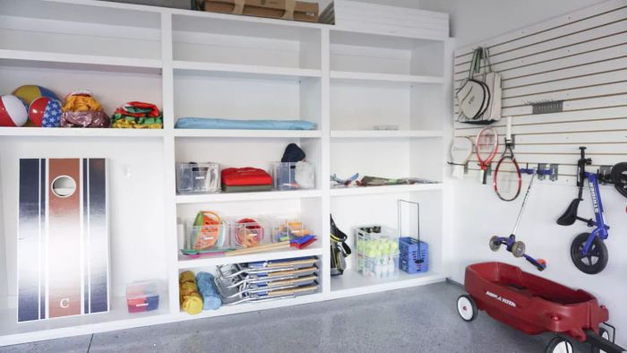 Sleek white adjustable shelving in a garage