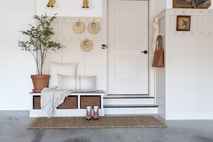 Garage Organization, Neutral Paneling, Textured Rug, and Woven Storage Bins