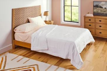 Buffy Breeze Comforter with matching pillows on a cozy bed