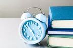 Clock and stack of books