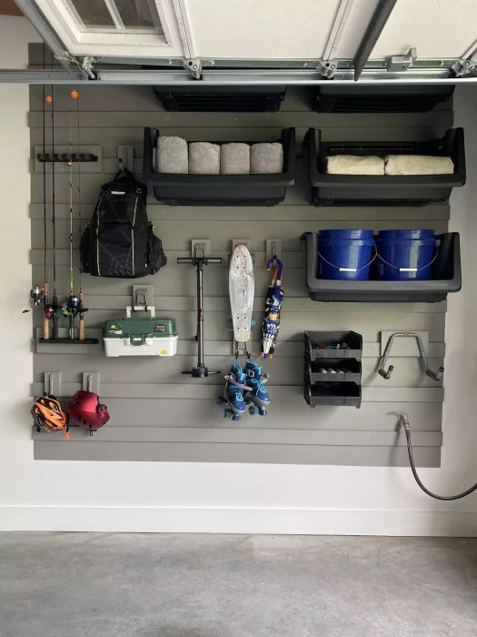 Gray Wall Featuring Modular Storage for Gear and Household Items