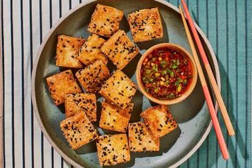 Sesame-crusted tofu served with a spicy dipping sauce
