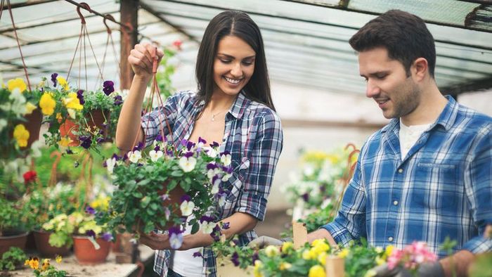 A couple inside a greenhouse