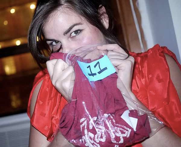 Woman sniffing T-shirt