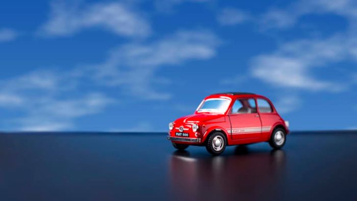 fiat toy car against a blue sky background