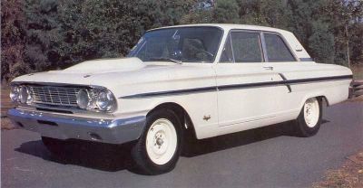 The 1964 Ford Thunderbolt, Ford's answer to the rising speed of Chevys and Mopars, was a powerhouse packed with the monstrous 427 big-block engine, housed in the compact Fairlane 2-door coupe. This required substantial frame alterations, including a prominent hood bulge to fit the high-rise manifold and twin four-barrel carbs, with air intake routed through dummy headlight openings in the grille. Despite its aggressive racing design, the Thunderbolt was a production car available at the dealership for $3,750. However, luxury and comfort took a backseat with features like plexiglass windows, fiberglass panels, and a stripped-down interior that lacked armrests, sun visors, mirrors, insulation, and radio or heater. Only 100 of these cars were sold in 1964, but they could still blaze down the quarter-mile in mid-11-second times.