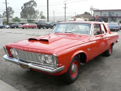 The 1963 Plymouth Savoy with the 426 Max Wedge engine was one of Mopar’s most formidable drag racing machines, and the engine itself was a standout feature. The Max Wedge, with its dual quads and 1:1 compression, generated 425 horsepower at 5,600 rpm, making it one of the most powerful engines available for drag racing. The engine was not intended for street use, as it was marketed as a 'racing only' engine, meant to dominate the drag strip. Most often installed in Plymouth's lightweight Savoy model, the Max Wedge could also be found in the Belvedere, Sport Fury, and even the Dodge Polara. A total of 2,130 vehicles were produced with this engine, and they could hit the quarter-mile in a blistering 12 seconds.