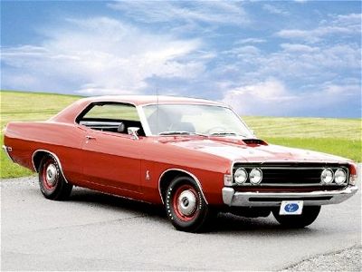 The 1969 Ford Fairlane Cobra, often just called the Cobra, was a performance-packed muscle car that remains a bit of a mystery for collectors. Despite being marketed under the Cobra name in Ford’s brochures and on dealer window stickers, these cars were technically Fairlanes, as the Torino name was only an option package for the Fairlane body style and not an independent model in 1969. Commonly referred to as either the Torino GT or Fairlane Cobra, this naming distinction is a point of contention among enthusiasts. The Cobra was available in two body styles: the rare hardtop, also known as the 'formal roof,' and the more popular fastback sports roof. The Cobra package included a 335-horsepower 428 Cobra Jet V8 with a Holly 4-barrel carburetor, and while the optional Ram Air didn’t boost horsepower, it did raise the engine's performance peak to 5,600 rpm. It also featured a locking rear differential, exclusive to Ford at the time. On the drag strip, Cobras could typically achieve quarter-mile times of around 14.5 seconds. It's estimated that about 14,000 Cobras were produced in 1969, with the fastback being the most common. However, I find the rare hardtop version, with only about 3,000 units built, much more appealing.