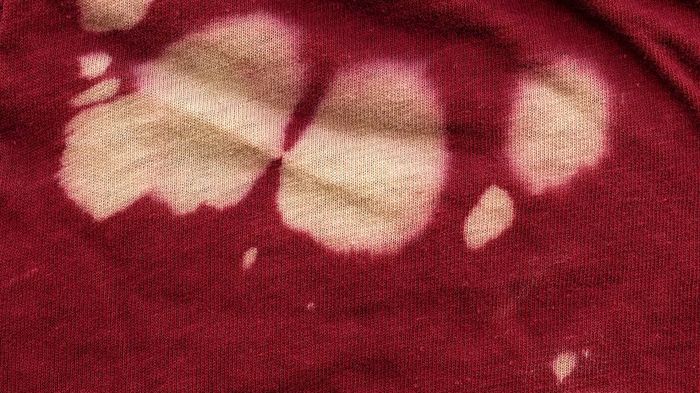 White marks on red cotton fabric