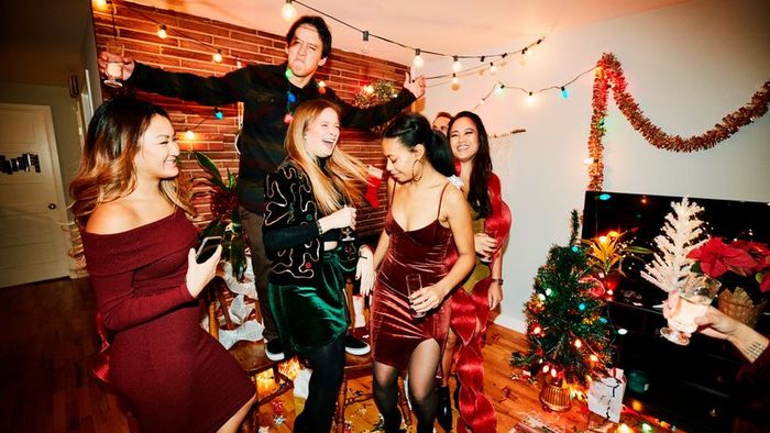 A festive group of friends enjoying a Christmas celebration.