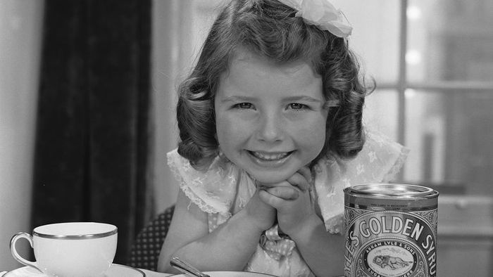 Tate & Lyle's Golden Syrup spread over a slice of bread