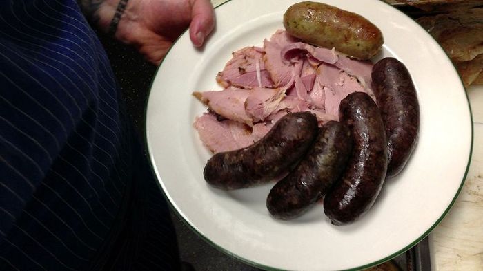 a plate featuring boudin sausage