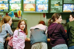 Family enjoying a meal at a fast-food counter