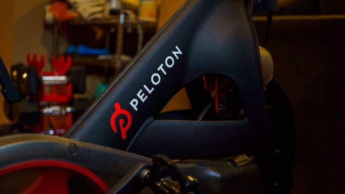 A close-up shot of the Peloton logo on a bike