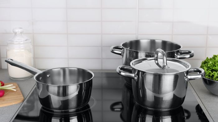 cleaning pots and pans on glass stovetops
