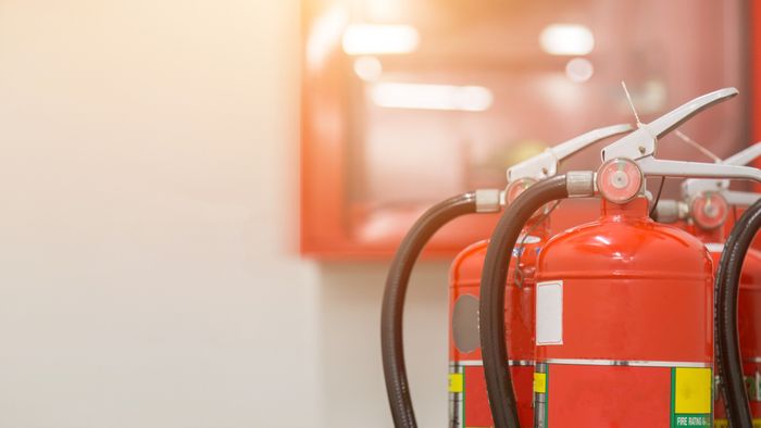 A lineup of fire extinguishers placed next to each other
