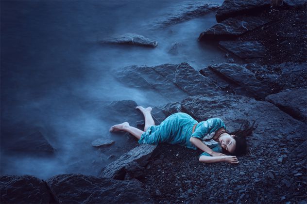 Beautiful young woman on sea