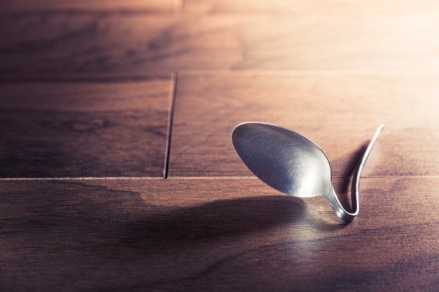 psychokinesis concept with bent spoon