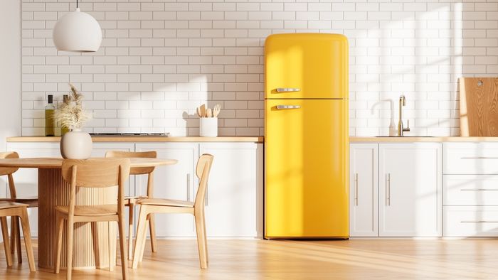 A vibrant yellow refrigerator in a modern kitchen