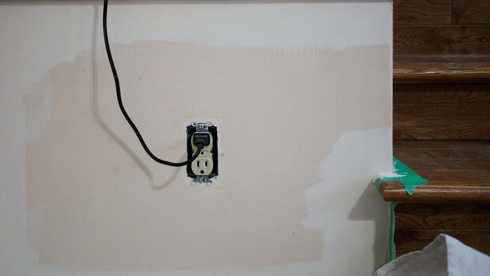 Uncovered electrical outlet posing a safety risk
