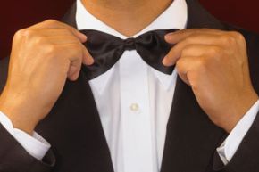 A man fixing his bowtie