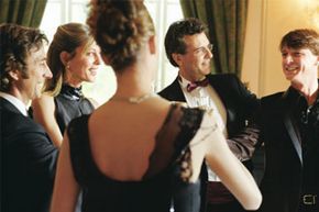 A group of guests in black tie attire at a wedding