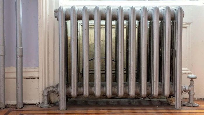 An antique silver radiator in a vintage home