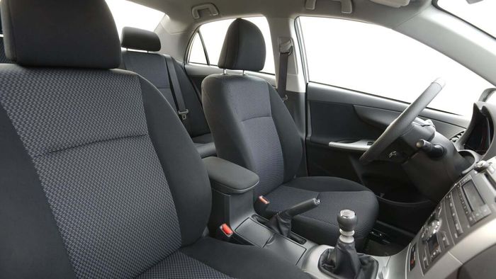 A close-up view of the driver's and passenger seats inside a vehicle