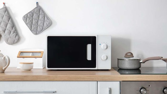 A contemporary microwave positioned on a kitchen countertop
