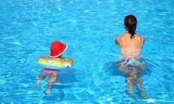 mother and baby swimming together