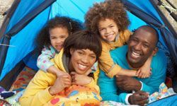 family enjoying a tent camping experience