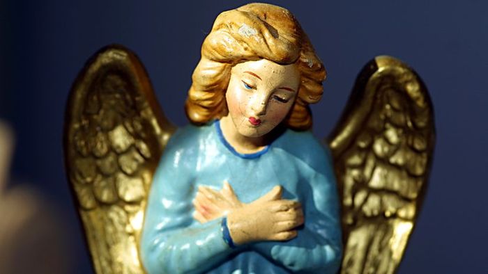 A classic blue Christmas angel with a vintage charm