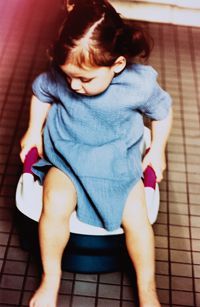 child using a potty