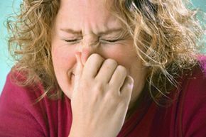 woman sneezing
