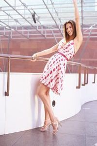 A woman holding onto a railing.