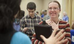 a young woman attending a job fair at her college