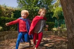 boys engaging in superhero play outside