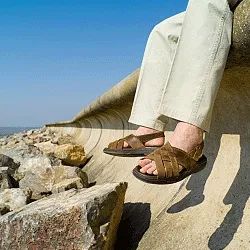 Slide sandals offer a broader range of styles compared to flip-flops, with options spanning from vibrant plastic designs to sophisticated woven leather.