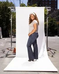 A woman posing against a white background.
