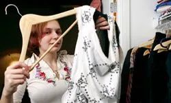 A woman organizing her closet.
