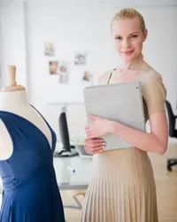A woman working in a fashion office.