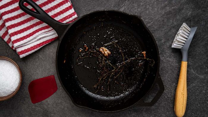 Remove stubborn food buildup from cast iron