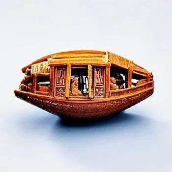 1.1257946946.Boat-Carved-From-An-Olive-Pit