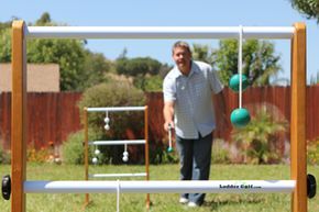 a man enjoying a game of ladder ball
