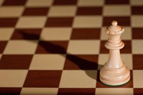 a white queen positioned on a chessboard