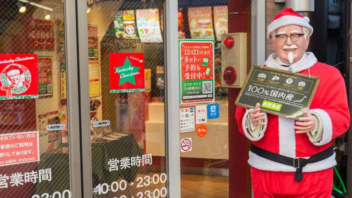 A Santa-themed Colonel Sanders statue stands outside a KFC in Japan (Kentucky Fried Christmas—Japan)