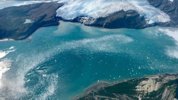 NASA's aerial imagery reveals Alaska's Icy Bay in the Wrangell-Saint Elias Wilderness, showcasing a dramatic transformation from a century ago when the area was entirely encased in ice.