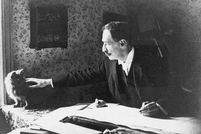Louis Wain at his drawing board, 1890s