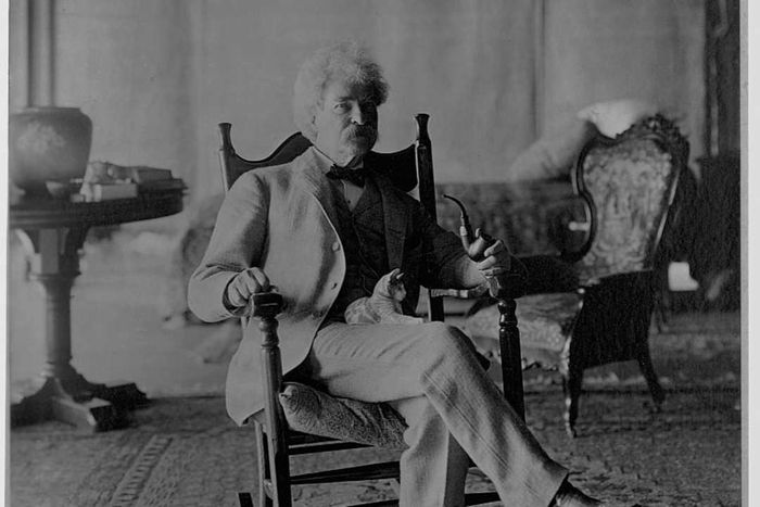 Mark Twain Holding Cat on Lap