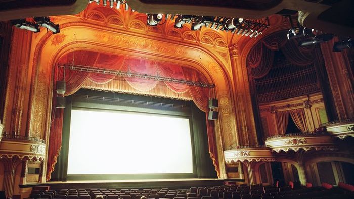 A massive display screen in a movie theater.